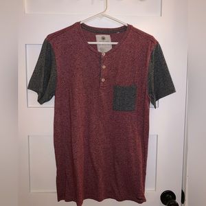 On the byas small black and maroon tshirt